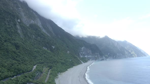 Aerial video of mountain and beach.