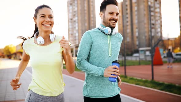 Beautiful Couple Jogging and Fitness Training Outdoor