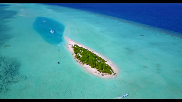 Aerial drone view sky of tranquil seashore beach lifestyle by clear sea with white sandy background 