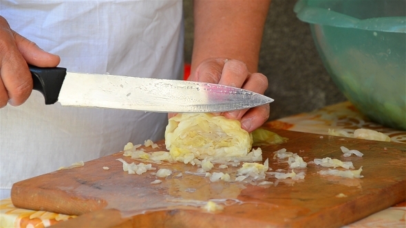 Woman Cutting Cabbage With Knife 02