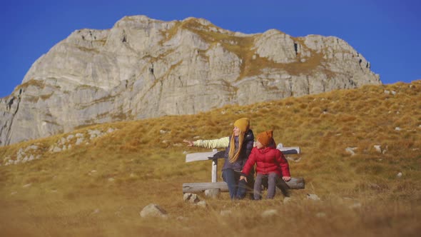 Family of Tourists Visits the Sedlo Pass Bobov Kuk in the Mountains of the Northern Montenegro