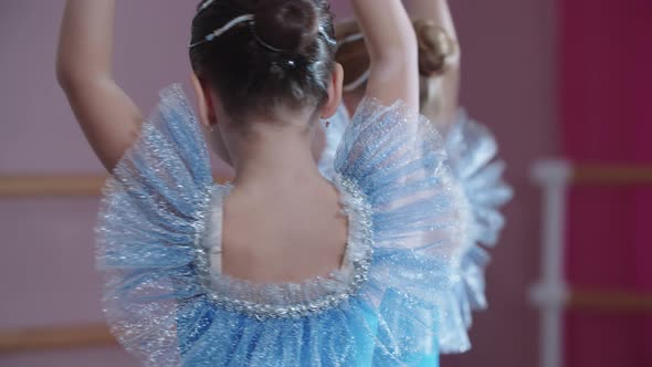 Ballet Training  Ballerina Girls in Blue Dresses Spinning on the Spot in Ballet Studio