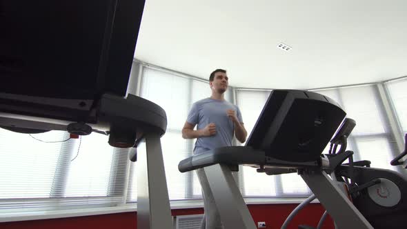 Man Over 30 Years Old on a Running Simulator
