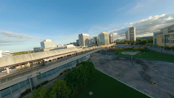 Coliseo De Puerto Rico Jose Miguel Agrelot FPV Drone Shot near a Train station at colorful sunset 2