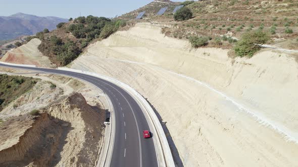 Aerial footage of epic highway valley in Greece. Drone view of freeway winding through Crete.