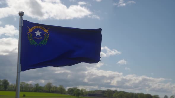 Flag of Nevada State Region of the United States Waving at Wind