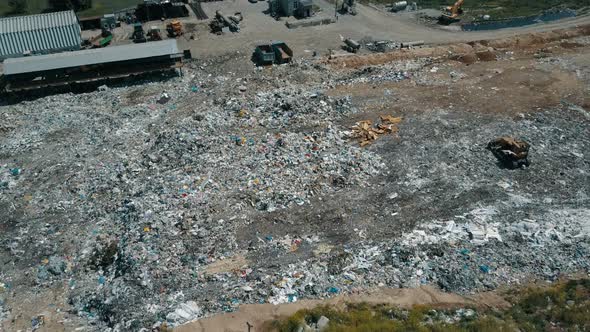 Aerial View of City Garbage Dump. Gulls Feeding on Food Waste Fly Over It