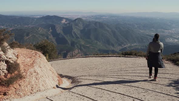 Guy descends a steep slope from a mountain, Spain