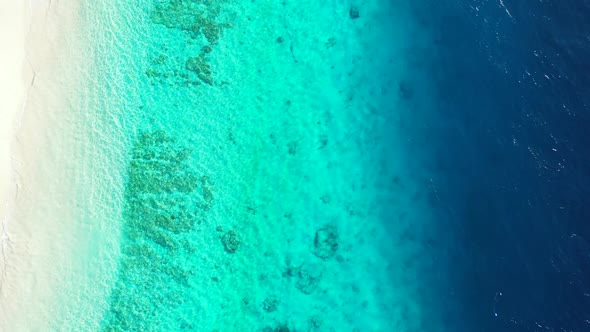 Aerial panorama of marine coast beach time by shallow lagoon with white sandy background of adventur