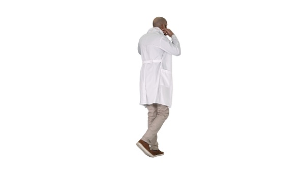 Walking doctor putting white robe on on white background.