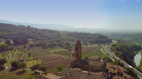 Flying Backward Over Tuscany Old Buildings in Italy