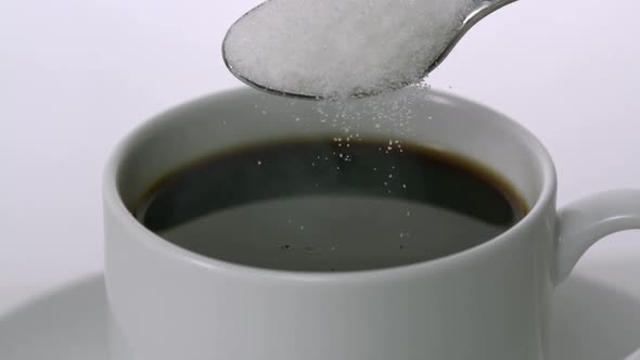 Sugar poured into coffee, Slow Motion