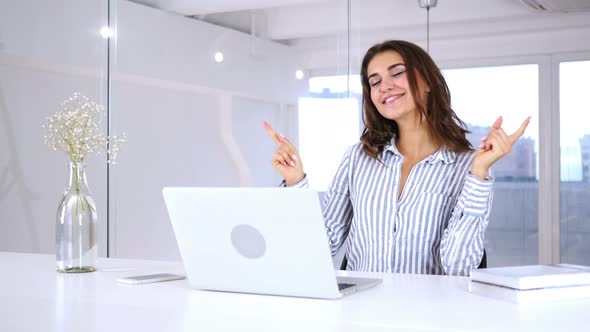 Dancing Beautiful Hispanic Woman at Work, Listening Music and Enjoying Life