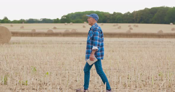 Farmer Using Digital Tablet on Field Agriculture