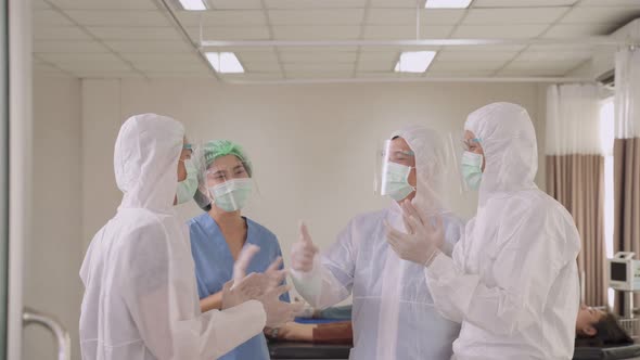 Group of Asian Professional medic doctors and nurse in PPE suit working in Hospital emergency room.