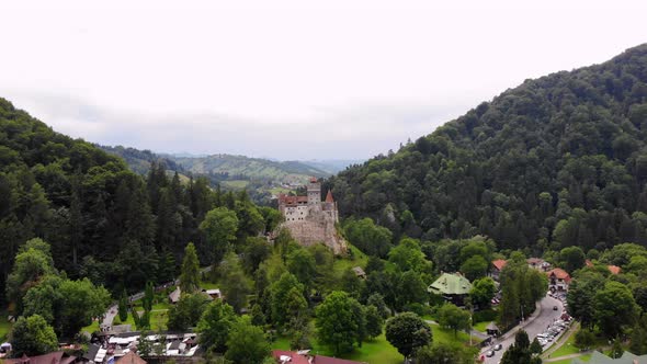 Aero. Panoramic View of the Ancient Bran Castle on a Hill , Dracula Castle, Transylvania, Brasov