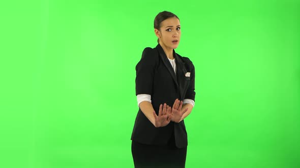 Woman Strictly Gesturing with Hands Shape Meaning Denial Saying NO. Green Screen