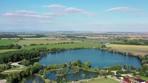 Aerial view of a natural swimming pool in the town of Surany in Slovakia