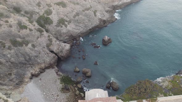Aerial view from above of a small sea inlet next to Fortress of Beliche Sagres Algarve Portugal.