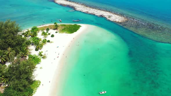 Aerial drone landscape of tropical island beach time by turquoise water with white sandy background 