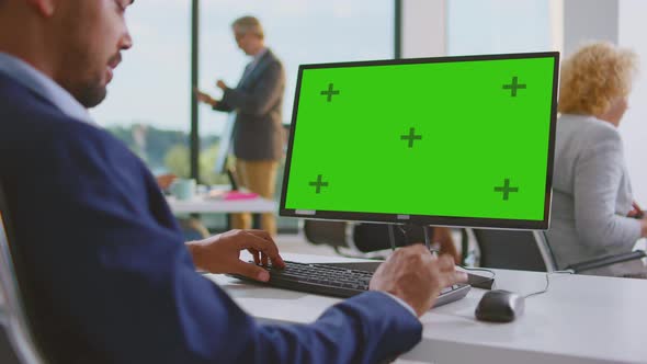 Man working on computer in shared office