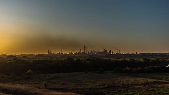 A Large Industrial Plant Producing Black Smog Pollutes the Air