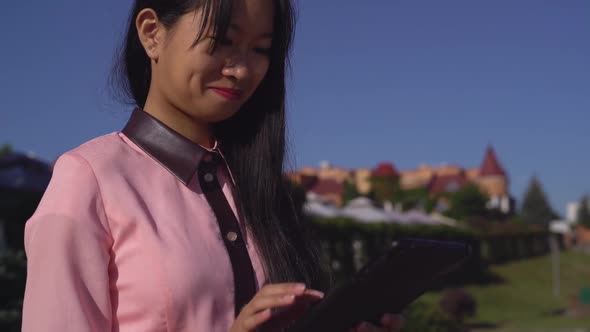 Fashionable Lady with Gadget Outdoors