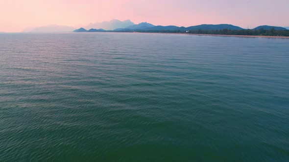 4K Aerial view of drone move on beautiful sea. sunset over ocean waves.