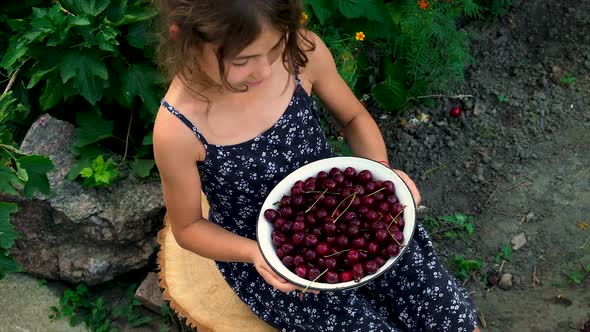 The Child Eats Cherries in the Garden