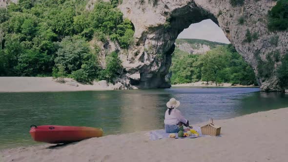 Couple on the Beach By the River in the Ardeche France Pont d Arc Ardeche Franceview of Narural Arch