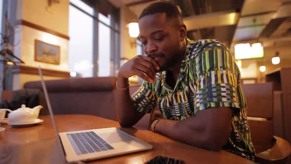 AfricanAmerican Working on Laptop