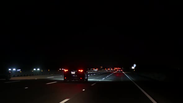 View From the Car. Los Angeles Busy Freeway at Night Time. Massive Interstate Highway Road 