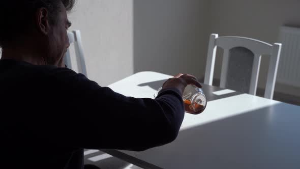 Stressed Man Pouring and Drinking Alcohol