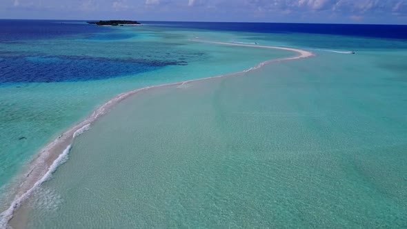 Aerial drone seascape of tropical coast beach voyage by ocean with sand background