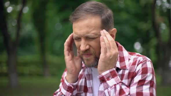 Sick Man Massaging Temples, Suffering From Migraine, Sharp Pain, Neurology