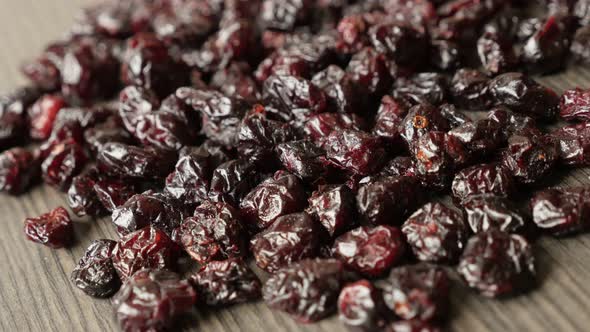 Healthy dehydrated  cranberries on table shallow DOF 4K 2160p 30fps UltraHD   footage - Red dried be