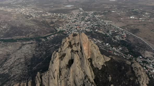 Aerial View Of Peña de Bernal, Mountain Peak With Bernal Village In Background In Queretaro, Mexico.