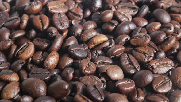 Dark coffee background with roasted beans 4K video
