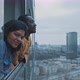 Multi ethnic couple enjoy view of city skyline - VideoHive Item for Sale