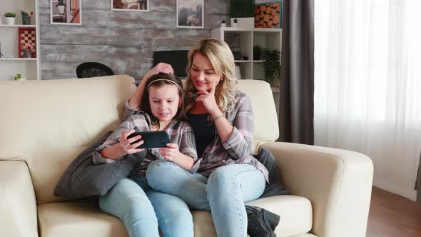 Zoom in Shot of Mother and Her Daughter with Braces