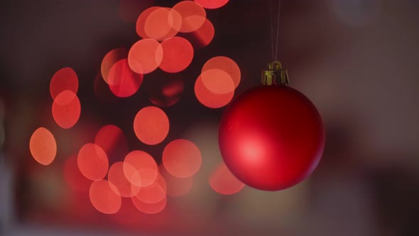 Christmas Red Balls with Ribbons Isolated on Defocused Background 