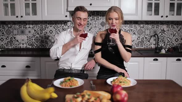 Romantic Talking Couple Drinking Wine in Dinner