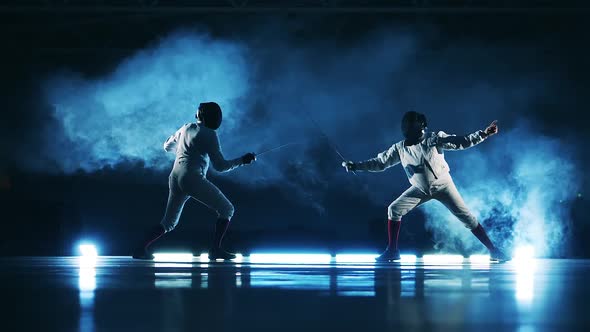 Slow Motion of Two Opponents Attacking Each Other While Fencing