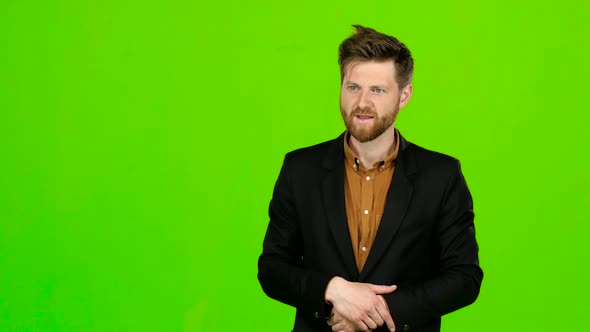 Guy Flirts, He Smiles and Builds His Eyes. Green Screen