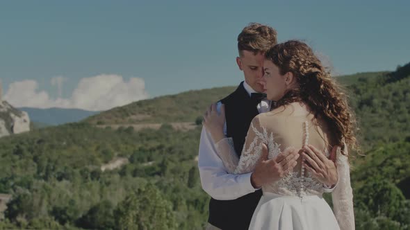 The Bride and Groom Embrace