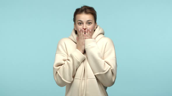 Slow Motion of Happy Pretty Girl in White Hoodi Gasping and Looking Surprised Smiling Cheerful Hear