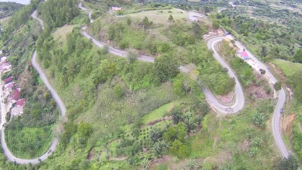 Aerial shot of the winding road over the mountain