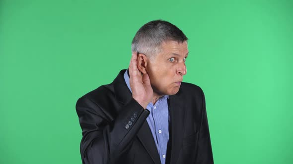 Portrait of Aged Man Holding Hand Near Ear Trying To Listen To Interesting News Expressing