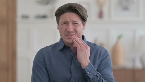 Portrait of Sick Young Man having Toothache