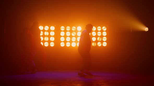 Silhouettes Three Talented Hiphopers Performing on Stage